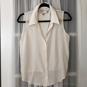 Sleeveless cream colored blouse